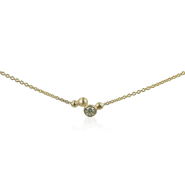 Bubbles - Guld halskæde med 14 kt. guldbobler samt 0,30 ct. top wesselton If     Unik halskæde, med smukke bobler, et moderne tvist til en flying diamond. Eksklusiv, smuk og elegant.