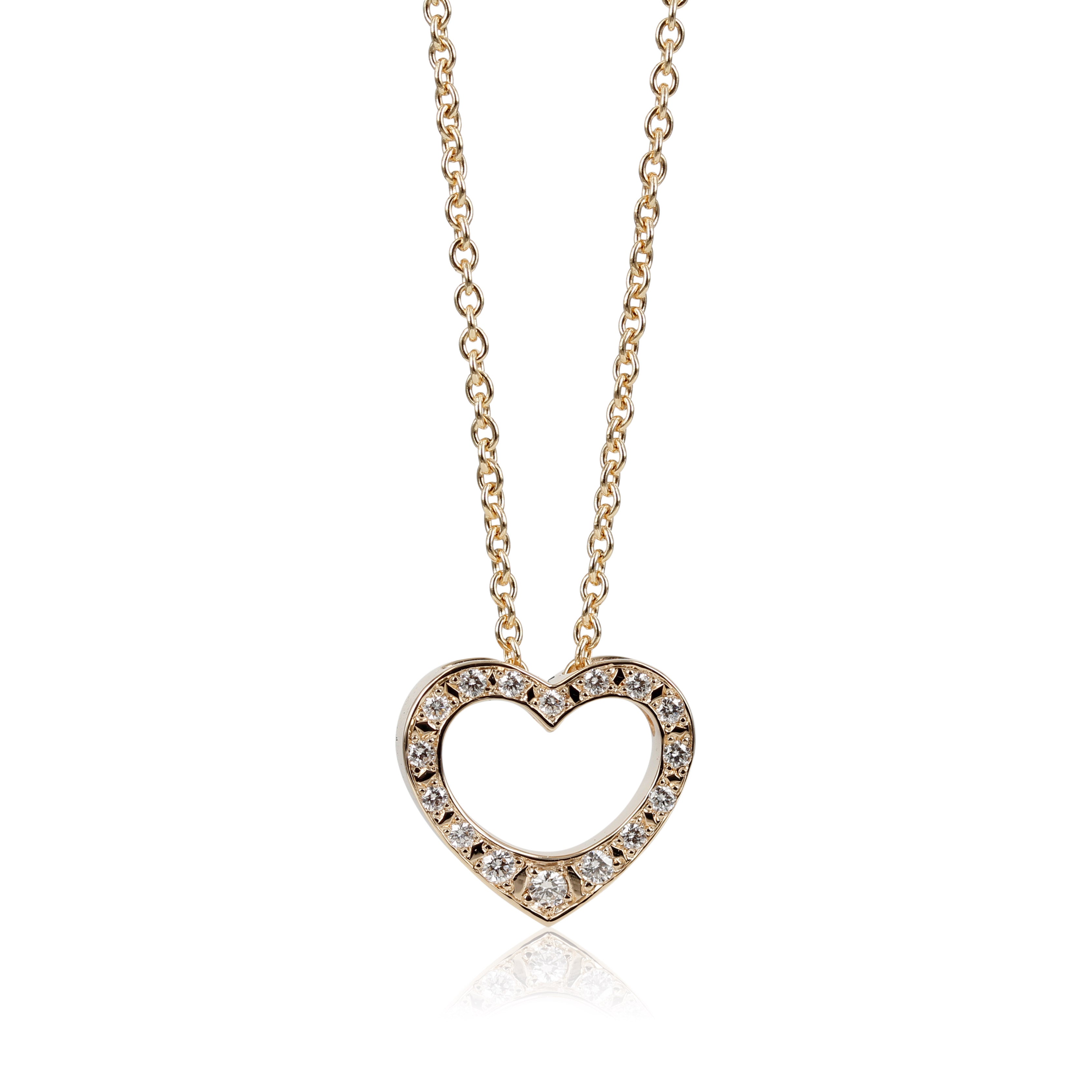 Kærligheds hjerte med diamanter. Smukt guldvedhæng udformet som et hjerte.